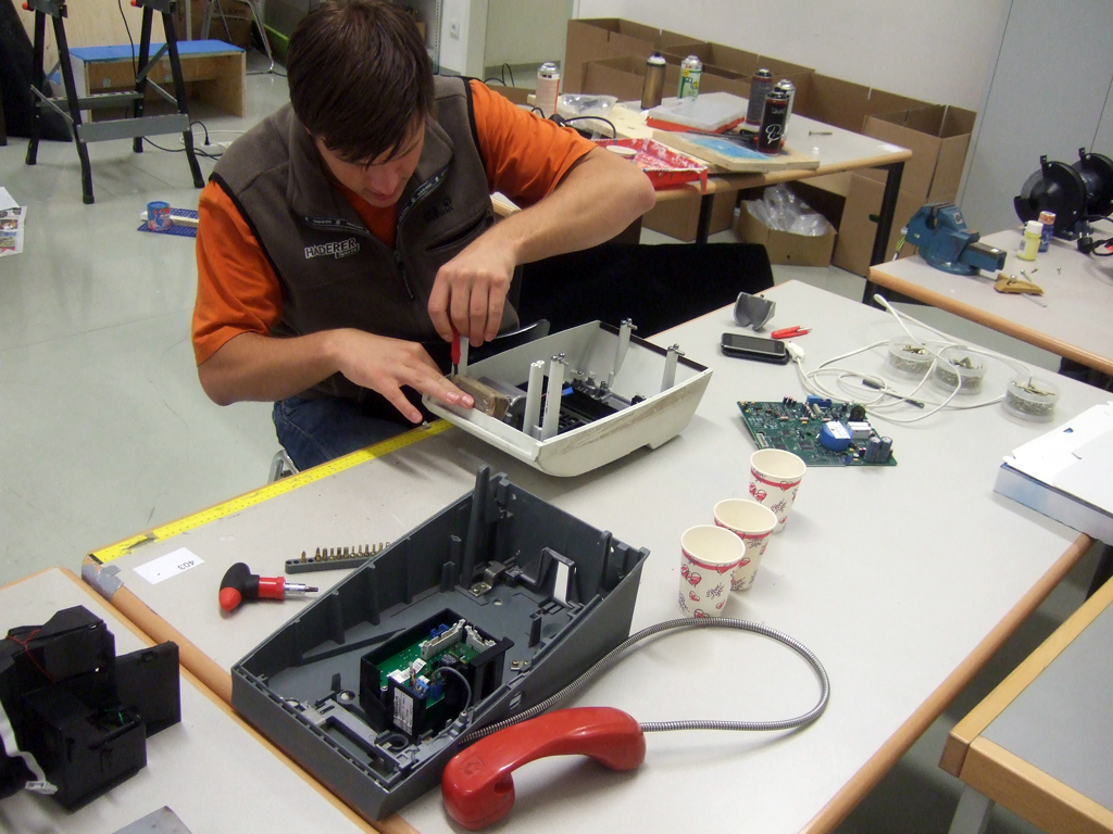 Removing all internals of the pay phone Removing all internals of the pay phone